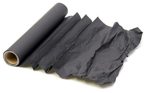 A roll of cinefoil. Very matte paper which completely obstructs light. Notice the right part, folded and partially damaged. Holes might appear due to degradation.
